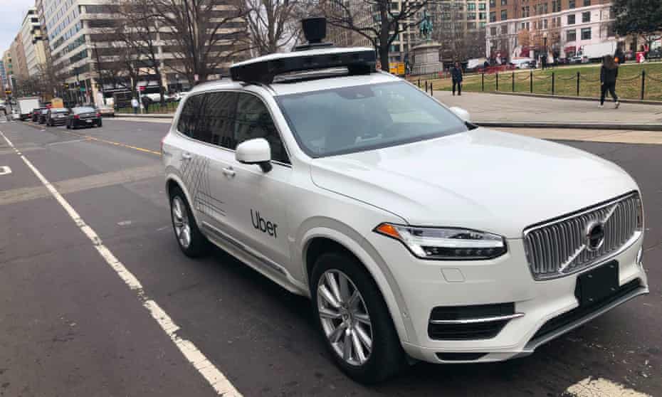 An Uber car equipped with cameras and sensors drives the streets of Washington DC