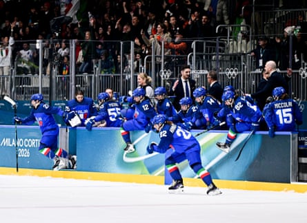Italy’s substitutes pour on to the ice after their quarter-final place is confirmed.