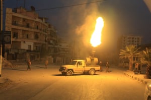 Free Syrian Army fighters aim anti-aircraft artillery at Russian fighter jets