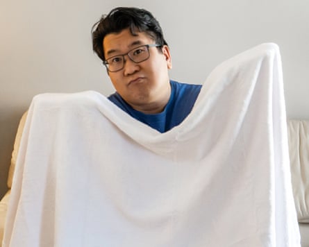 A person holding an American Soft Linen Oversized Bath Sheet