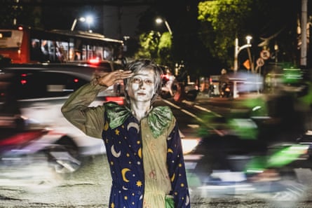 Faqih Ibnu Ali, 28, who works as one of the city’s “silvermen’.