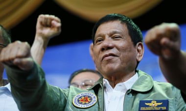 President Rodrigo Duterte gives a fist salute during a visit to the Philippine air force headquarters in suburban Pasay city, south-east of Manila.