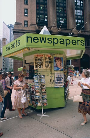 People queue to buy an afternoon paper at a newspaper stand in Martin Place, 1983