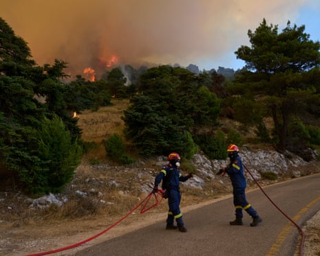 Firefighters operate on Mount Kithairon near Porto Germeno, northwest of Athens, Greece.