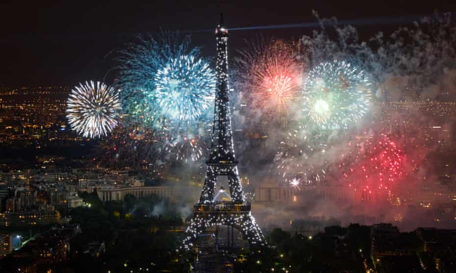 The Eiffel Tower, illuminated during the traditional Bastille Day fireworks display in Paris.