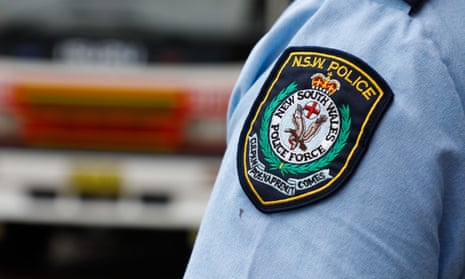 A NSW police patch on a police officers shirt.