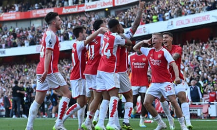 Arsenal's Gabriel Jesus is mobbed by his teammates after scoring his third goal