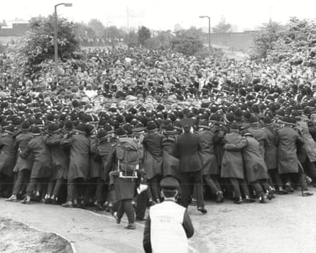 Police holding back miners.