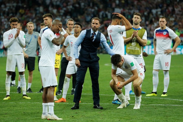 Gareth Southgate consoles his players.