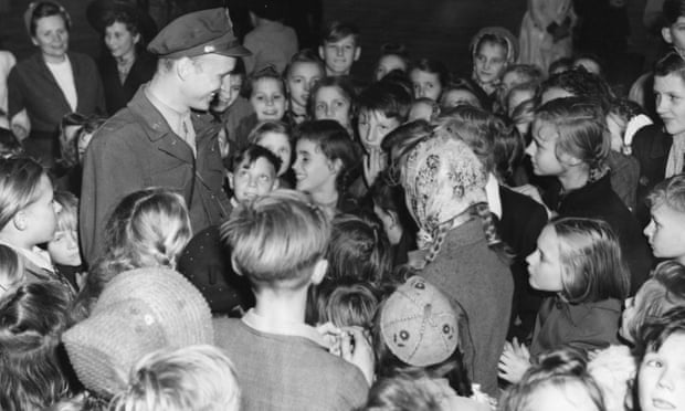Berlin children thank Lieutenant Gail Halvorsen for the thousands of packages of gum and candy he and his friends dropped over Berlin, 1949.