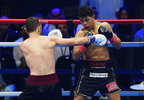 Jaime Munguía and Nikita Zon exchange punches during their WBA super-middleweight title fight on Saturday night in Riyadh