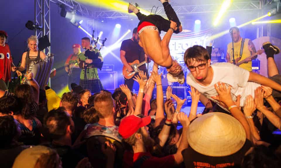 Fans crowd surf to Irish punk band Flatfoot 56 at Audiofeed Festival in Urbana, Illinois.
