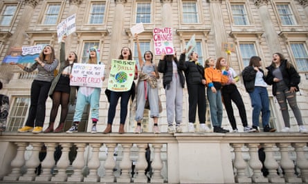 Students from the Youth Strike 4 Climate movement during a climate change protest in London on 15 February.