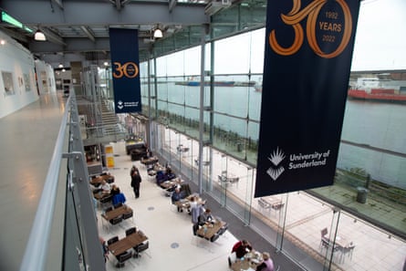The museum’s interior seen from above with people sitting in the cafe and banners saying 30 years of University of Sunderland