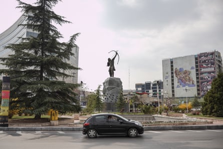 Car driving around a roundabout in Tehran