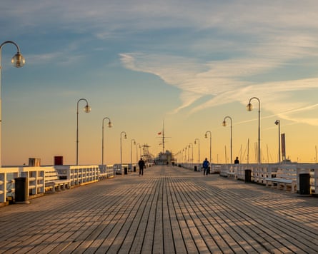 Wooden decked pier at sunset