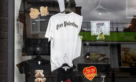 A shop window reading ‘free Palestine’ on several t-shirts