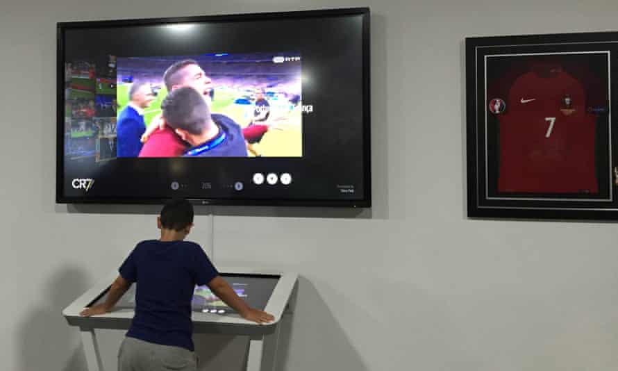 A young visitor views the ‘interactive timeline’, which shows a range of clips from Ronaldo’s career. On screen is one of the 31-year-old celebrating Portugal’s Euro 2016 triumph