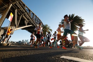 Runners pass beneath the Harbour Bridge