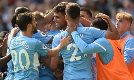 Manchester City’s Rodrigo (centre) celebrates with teammates after scoring his team’s fourth goal.