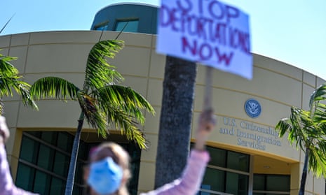 Demonstrators protest outside the US Citizenship and Immigration Service office in Miami, on February 20, 2021, demanding that the administration of US President Joe Biden cease deporting Haitian immigrants back to Haiti.