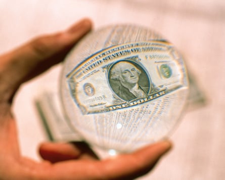 A dollar in a magnifying glass.