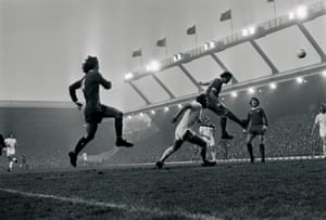 Kennedy sends a header towards goal against West Ham at Anfield in November 1974