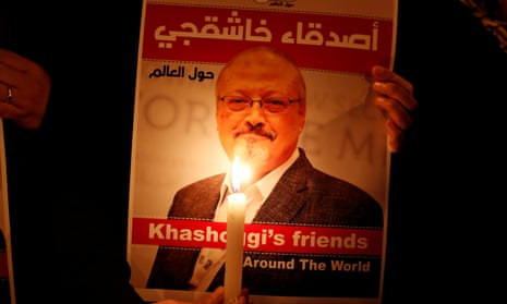 A demonstrator holds a poster with a picture of Saudi journalist Jamal Khashoggi outside the Saudi Arabia consulate in Istanbul, Turkey, on October 2018.
