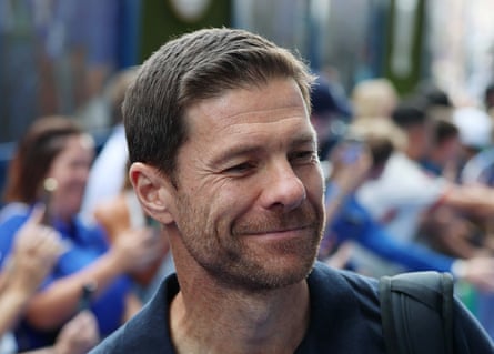 Xabi Alonso smiles as he walks past fans