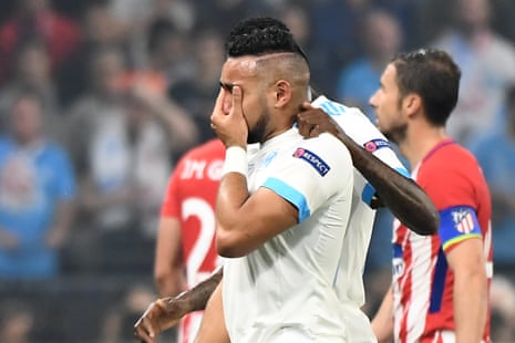 Marseille’s Dimitri Payet tries to hide his tears of disappointment as he leaves the pitch.