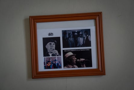 Framed photographs recognising the musical career of Luis Alberto Gómez hang on the walls of his home in Valparaíso