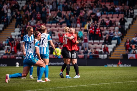 Lea Schüller celebrates scoring her goal with Leah Galton during Manchester United v Brighton