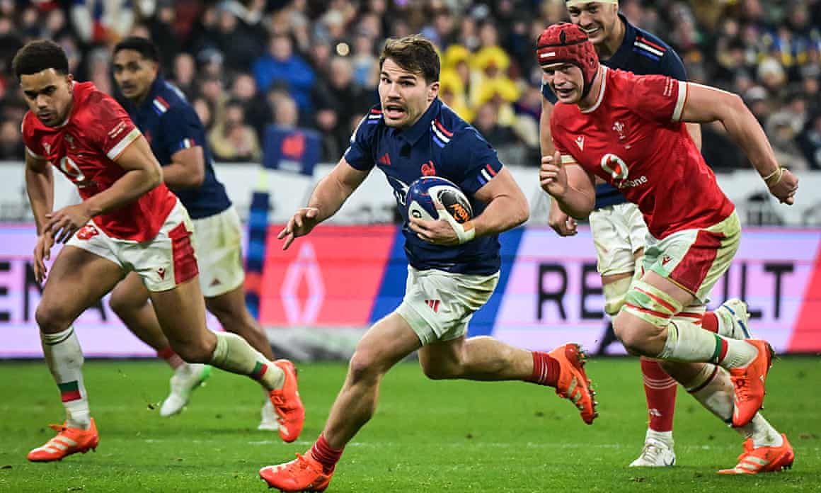 Antoine Dupont breaks through the Wales defence in their opening Six Nations match at Stade de France