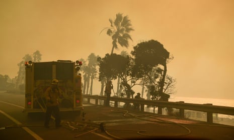 Smoke from Thomas fire near Ventura, California<br>epa06375327 Firefighters work in heavy smoke from the Thomas fire along the Pacific Coast Highway near Ventura, California, USA, 07 December 2017. An outbreak of several fires North of Los Angeles has occurred as one of the strongest Santa Ana winds forecast of the season is ongoing and expected to last several days. EPA/JOHN CETRINO