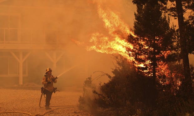 Firefighter tackling a fire north-west of Santa Cruz, California
