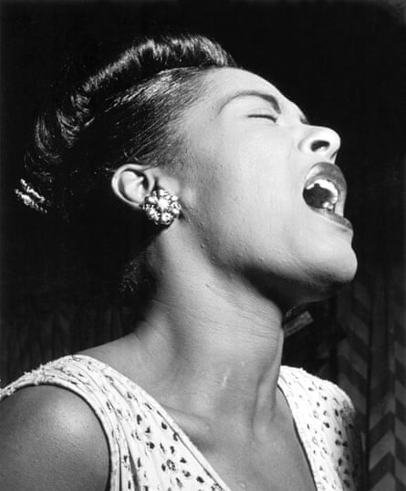 Black and white image of singer Billie Holiday performing in a New York nightclub in 1947