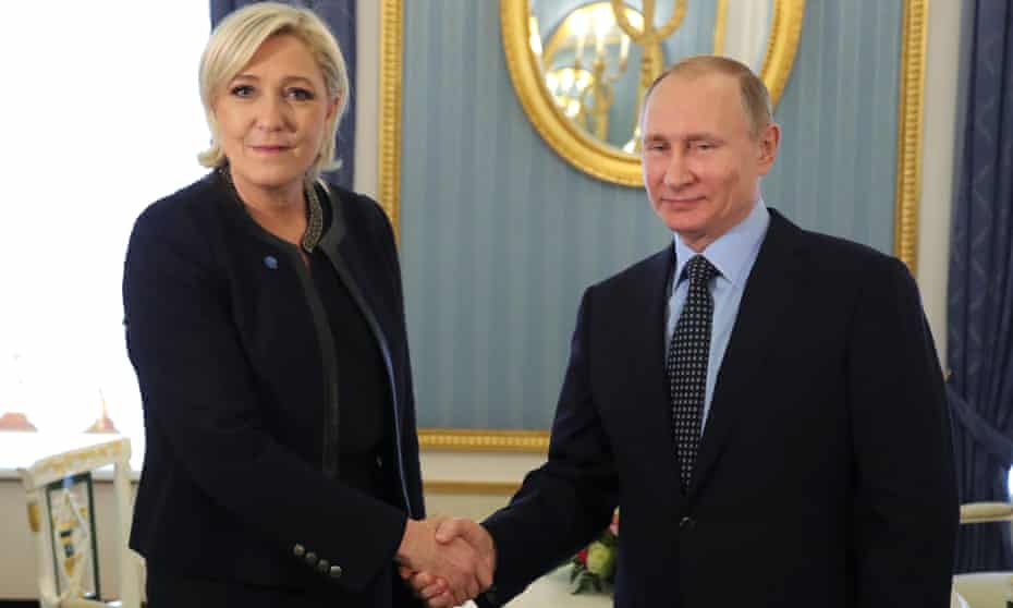 Marine Le Pen shakes hands with Vladimir Putin in 2017