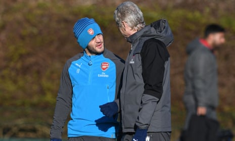 Arsenal manager Arsène Wenger talks to Jack Wilshere during training at London Colney on Friday.