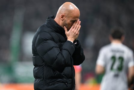 Paul Simonis puts his hands to his face.