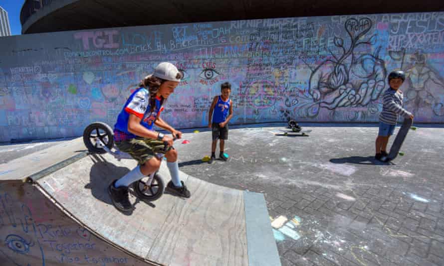 Children play in front of a barricade erected outside parliament in Wellington.