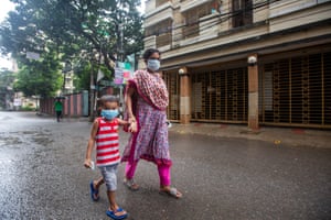 A child and his mother wearing masks in Dhaka, Bangladesh, on Friday.