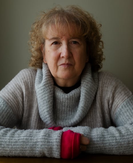 Portrait of Karen Newton, a British woman who was detained by ICE in the US for weeks, looking straight to camera, wearing a grey jumper