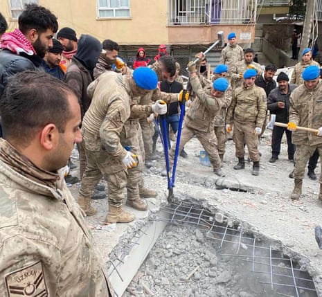 Turkish soldiers working breaking up rubble in Adiyaman city, southeast Turkey.