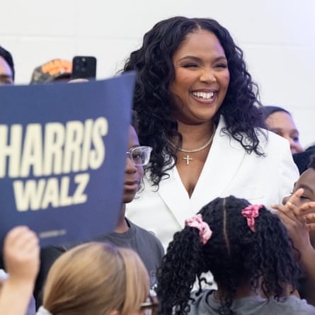 Lizzo attends a rating out the vote marketing campaign rally with Harris at a high college in Detroit, Michigan.