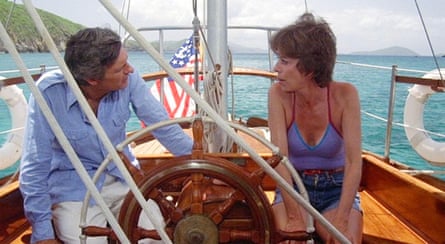 Alan Alda and Carol Burnett in The Four Seasons - she is a swimsuit and him in a blue shirt and white trousers on a smart sailing boat with blue sea in background
