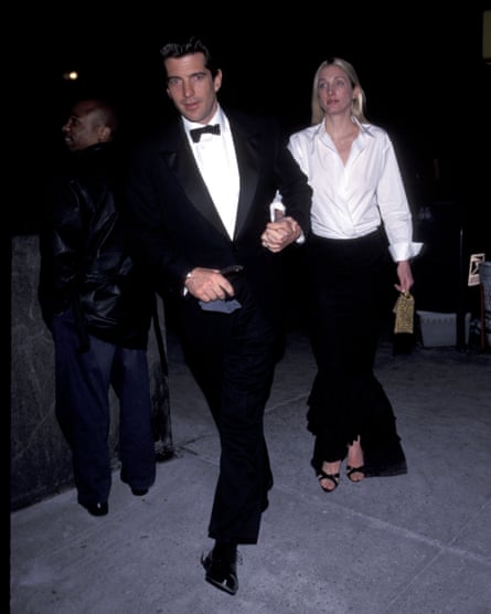 Kennedy Jr wearing a tuxedo and Bassette Kennedy wearing a white shirt and black skirt