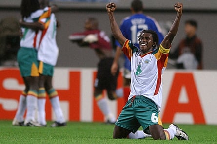 Senegal’s Aliou Cissé on his knees in celebration at the final whistle in Seoul