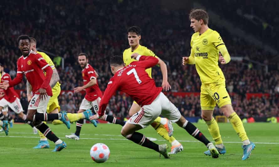 Manchester United v Brentford: Premier League – live! | Premier League 2 Brentford’s Mads Roerslev looks on as Manchester United’s Cristiano Ronaldo hits the deck.