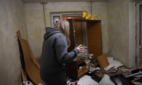 Lilya, 19, inspects her bedroom in the aftermath of shelling of residential buildings in Kostiantynivka, in the Donetsk region.