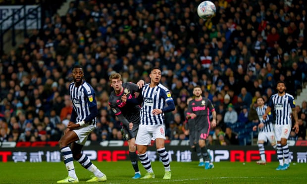 Patrick Bamford watches the ball as his header deflects in off West Brom’s Semi Ajayi, to give Leeds a 1-1 draw